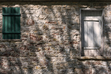 Sun-Dappled Light and Shadow on Textured Wall