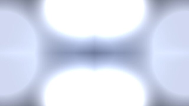 Blurry white circles on a gray background with soft edges and subtle gradient.