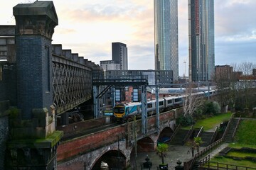 Buildings and train in Manchester, UK