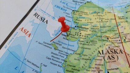 Fototapeta premium View of Teller, City in Nome Census Area, Alaska, United States, on a geographical map of America, seen using a magnifying glass