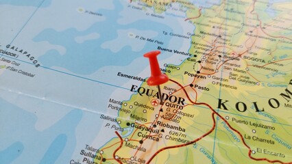 Naklejka premium View of Quito, officially San Francisco de Quito, is the capital and second-largest city of Ecuador, on a geographical map of America, marked with red push pin