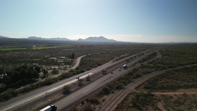 Aerial above Interstate 19 south of Tucson Arizona with desert mountains