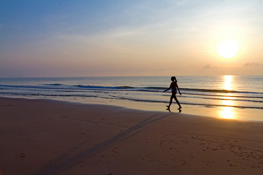 Women with sunrise walking