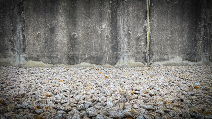 Grunge concrete wall background combined with a textured granite stone floor,