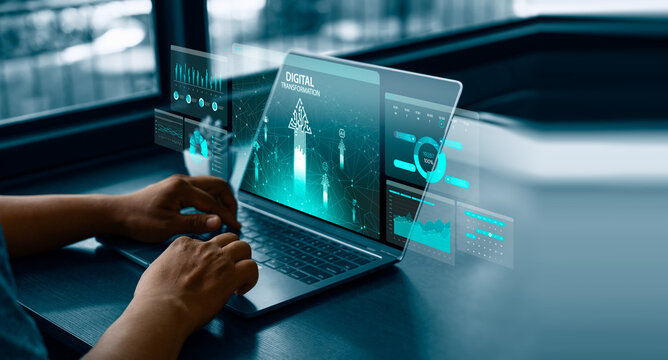 Business professional using laptop with transparent digital dashboards, data charts, analytics interfaces, digital transformation, technology integration, data-driven decisions