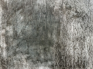 white acrylic paint texture on dark gray canvas. highly textured background.