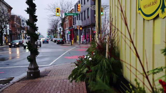 Whitby Winter High Street After the Rain with Christmas Decorations Along the Sidewalk, Canada.