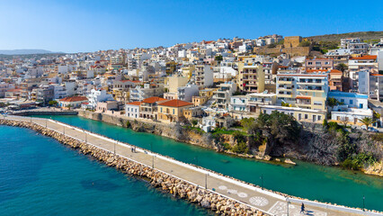 Naklejka premium The pictursque port of Sitia, Crete, Greece at sunset. Sitia is a traditional town at the east Crete near the beach of palm trees, Vai. 