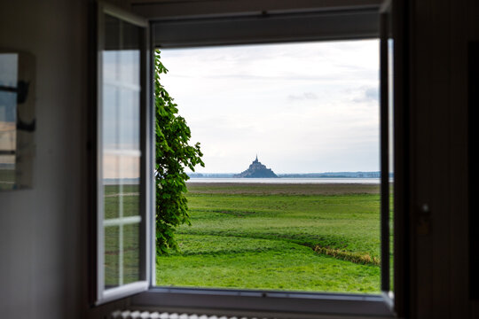 window view from a local house in genets normandy with beautiful meadow outside