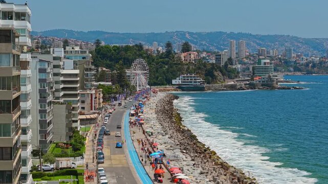 Aerial Establishing of Coastal Road Beach, Resort Buildings with Andes Mountains at Av Peru Vina del Mar Chile