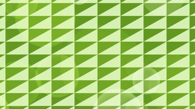 Geometric green triangle tessellation pattern in abstract design.
