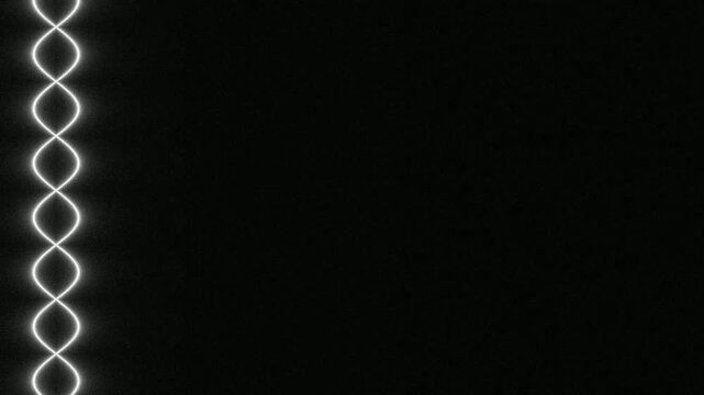 Close-up of LED light strip with glowing zigzag pattern in dark setting