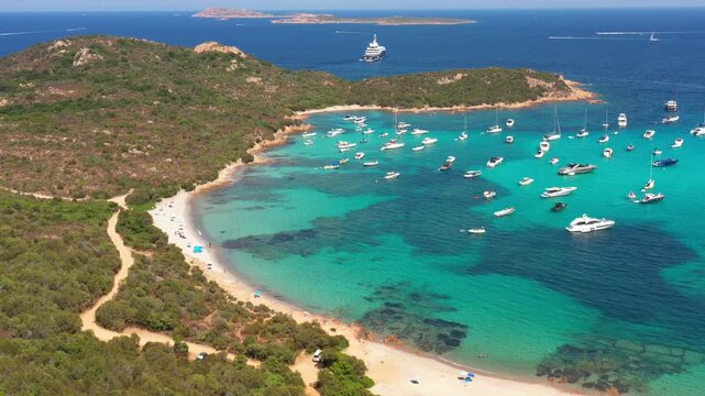 A postcard-perfect view of Sardinia&rsquo;s Costa Smeralda, where azure waters, golden sands, and luxurious yachts define summer.