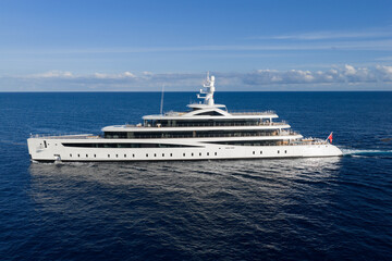 Obraz premium Motorboat sailing at sea. Luxury private yacht in sea. Motor yacht luxury vessel. Boat motor aerial. Vacation on summer. Aerial view motorboat. Luxury lifestyle. Vacation on summer. Yacht at sea