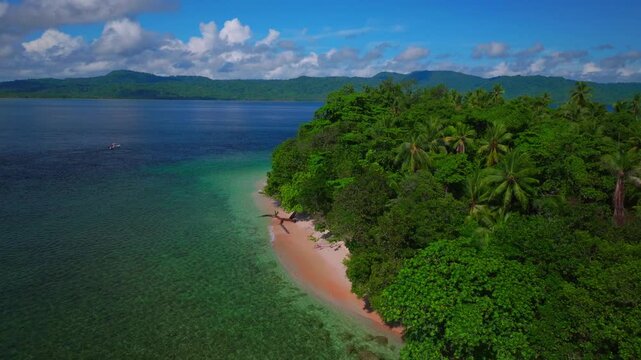 Fishing off boat Yuo Island village Wewak Sepik Region aerial drone Papua New Guinea PNG Papua Niugini sunny blue sky untouched coastline beach coral reef Madang Bismarck Sea Pacific Ocean circle left