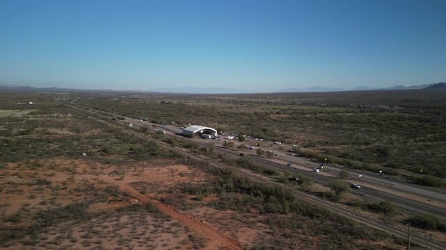 Aerial of traffic on I19 south of Tucson Arizona with customs facility