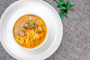 Minimalist Chicken Noodle Soup with Meatballs: Healthy Eating Concept. Close-up