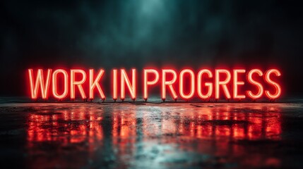 Bright red neon sign reading Work in Progress glowing against a dark background