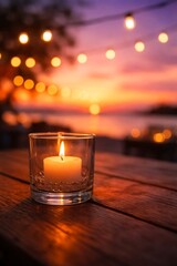 A close-up of a lit candle in a glass holder on a wooden table, with a sunset and string lights in the blurred background. generate images 