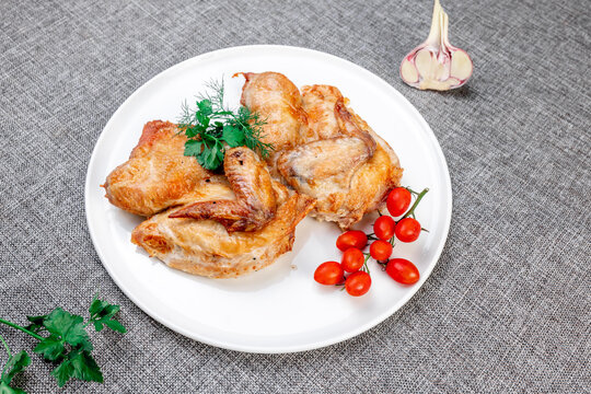 Authentic Georgian Chicken Tabaka with Cherry Tomatoes and Garlic