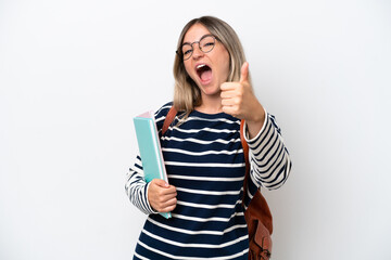 Fototapeta premium Young student Rumanian woman isolated on white background with thumbs up because something good has happened