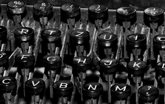 A black and white close-up of the keys from a vintage typewriter