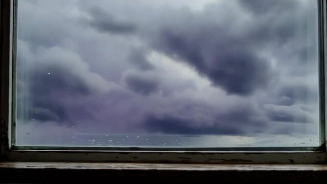 Cloud formations shift and change through a window across different frames. The content shows variations in cloud density and light conditions.