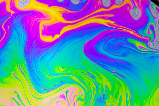 Psychedelic multicolored background abstract. Rainbow colors. patterns background. Photo macro shot of soap bubbles