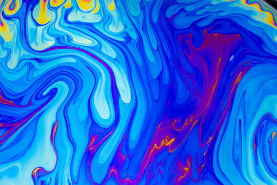 Psychedelic multicolored background abstract. Rainbow colors. patterns background. Photo macro shot of soap bubbles