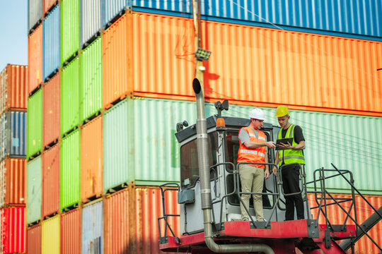 Industrial safety leaders review site assessment, hazard prevention checklist at cargo terminal. Visual represents proactive monitoring, workplace risk analysis and secure container handling workflow.