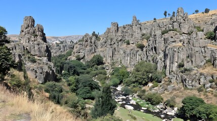 by river over centuries, dramatic rock formations showing power of natural environment