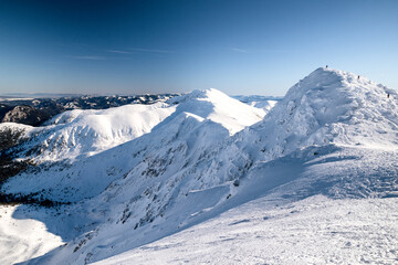 Obraz premium Snow covered ridge on Chopok peak in Low Tatras mountains above Jasna ski resort Slovakia