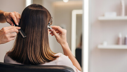 Naklejka premium Long bob haircut back view in salon