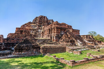 Ruins of Wat Mahathat, at the ancient Siam capital of Ayutthaya, Thailand. Located in the Ayutthaya Historical Park. A UNESCO World Heritage Site. 
