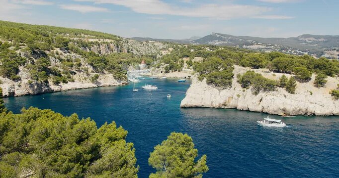 Marina access inside Calanque de Port-Miou with yachts and pleasure boats. Natural limestone fjord-like inlet on the French Mediterranean coast