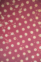 Vintage red polka dot pattern with distressed texture © Julia Jones