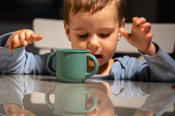 Three year old autonomy crisis shown through self feeding behavior.