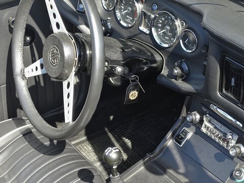 MG vintage car interior with steering wheel and dashboard