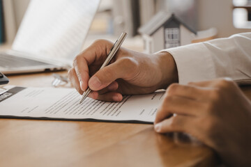 Hand of landlord, realtor pointing sign signature contract rental, purchase, buyer home or...