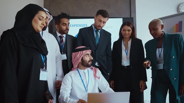 Western and emirati businesspeople in traditional arab attire participating in a conference with ceo, collaborating and taking notes in modern office environment