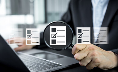Fototapeta premium Businessman searches online documents and archived files, reviewing digital reports and information to represent organized data management and efficient business documentation processes.