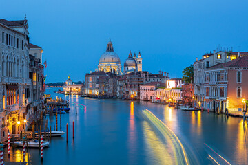 Obraz premium St Mark’s Basilica (Basilica di San Marco) in Venice, Italy, with a scenic canal view and classic Venetian architecture. Iconic landmark at Piazza San Marco featuring Byzantine domes, ornate marble fa