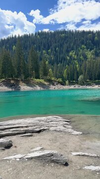 Caumasee Lake Cauma stunning turquoise lake in Flims, Switzerland vertical video