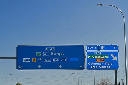 A road sign located on the M-40 motorway in the Madrid area, Spain, indicating exit 57 towards Colmenar Viejo and Tres Cantos.   February 14, 2026
