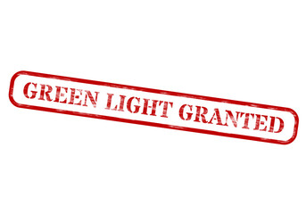 Red and white rubber stamp with green light granted text on black background