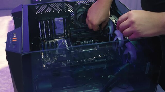 Connecting eight-pin CPU power cable to the motherboard socket and doing light cable management for clean system assembly
