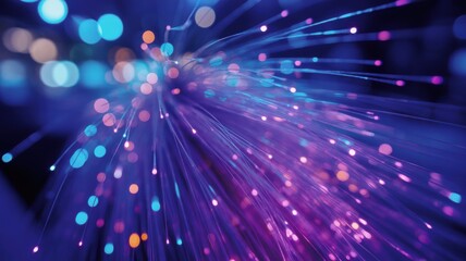 Obraz premium Abstract fiber optic background with glowing blue and purple light strands in dark space