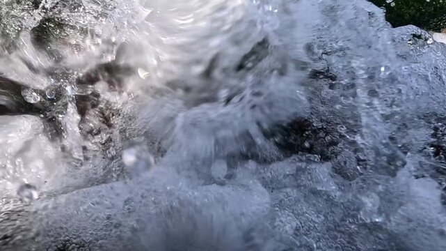 A turbulent stream of clean freshwater discharging from a pipe into the Black Sea, Odessa.