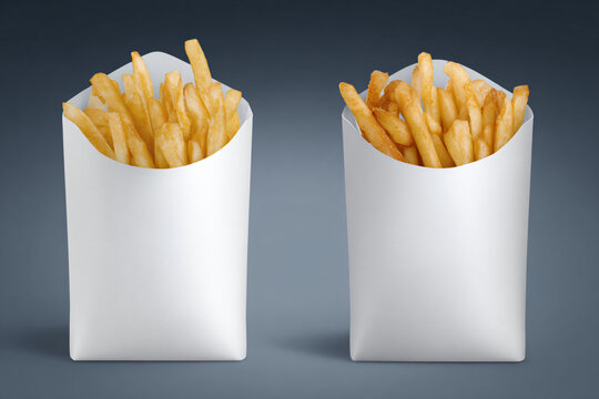 Two servings of golden french fries in paper containers against a dark gradient background from a high viewpoint