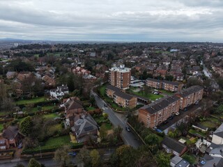 Fototapeta premium Elevated view capturing traditional British architecture, busy streets and mixed‑use buildings in a Wirral town centre. Suitable for heritage, planning and editorial projects.
